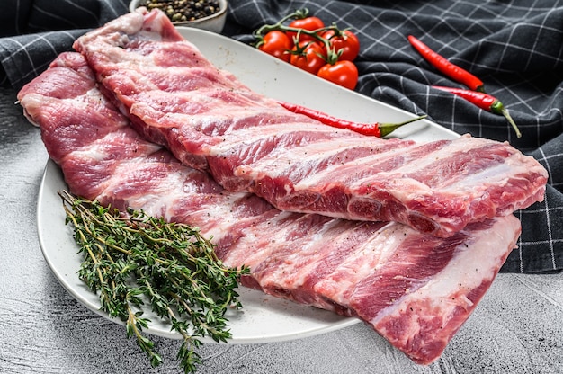 Fresh raw lamb spare ribs with spices and herbs