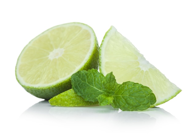 Fresh raw lime with mint leaf on white