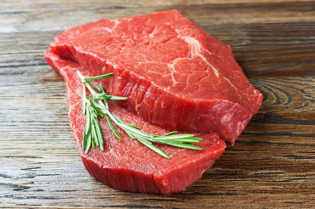 Fresh raw meat with rosemary