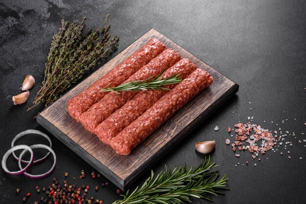 Fresh raw mince for grilled kebab with spices and herbs