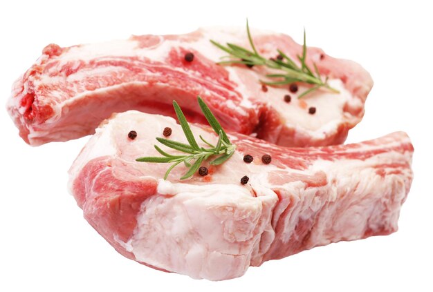 Fresh raw pork chops steak with herb and spices isolated