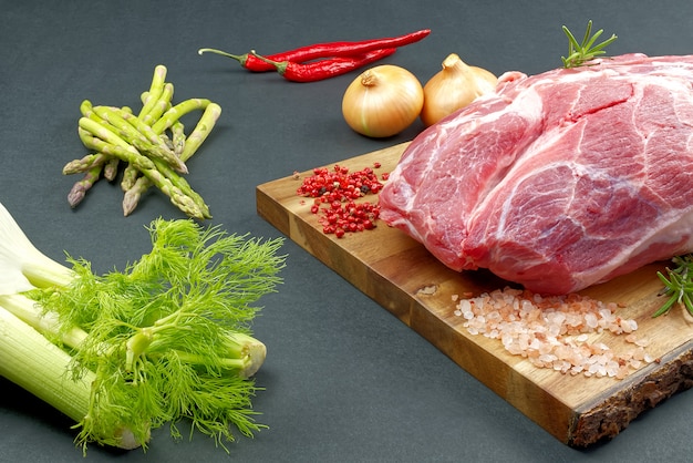 Fresh raw pork neck with spices and vegetables