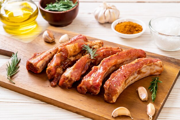 Fresh raw pork ribs ready for roasting with ingredients