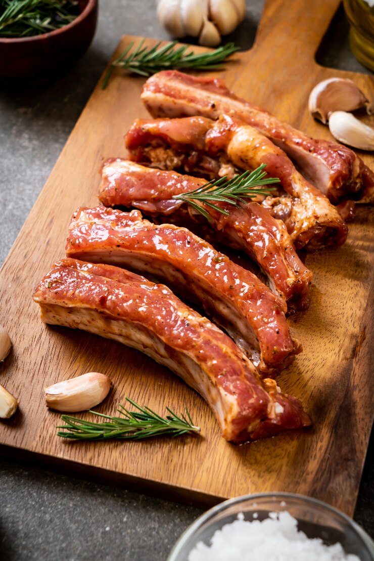 Photo fresh raw pork ribs ready for roasting with ingredients