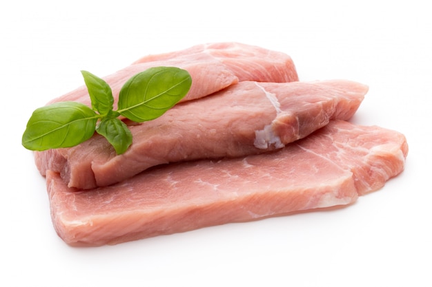 Fresh raw pork steak isolated on a bright  background