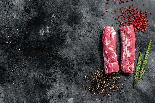 Fresh raw pork tenderloin with pepper and rosemary