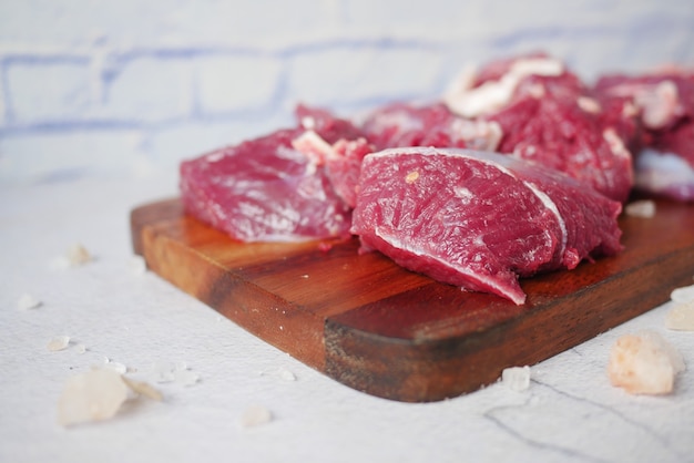 Fresh raw red beef meat on chopping board