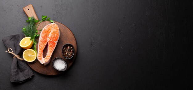 Fresh raw salmon cooking Fish steak with herbs and spices