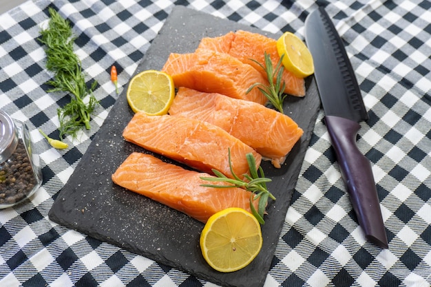 Fresh raw salmon fillet on stone plate