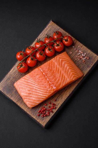 Fresh raw salmon red fish fillet with salt and spices