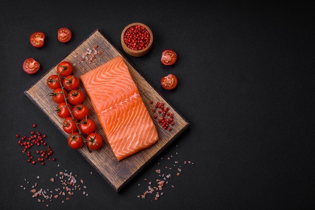 Fresh raw salmon red fish fillet with salt and spices