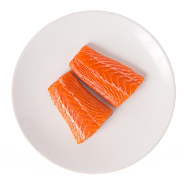 Fresh Raw Salmon Red Fish Steak on a dish isolated on a White Background