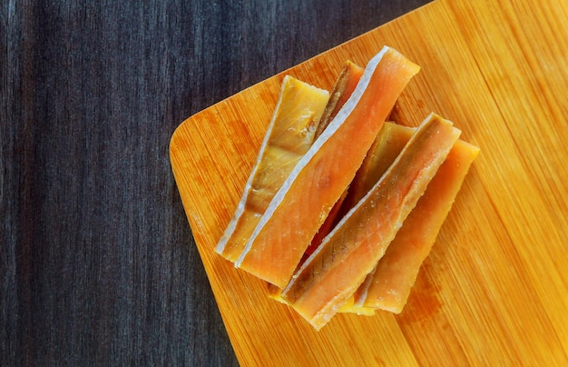 Fresh raw salmon  red tuna  and sole fish pieces over wooden board