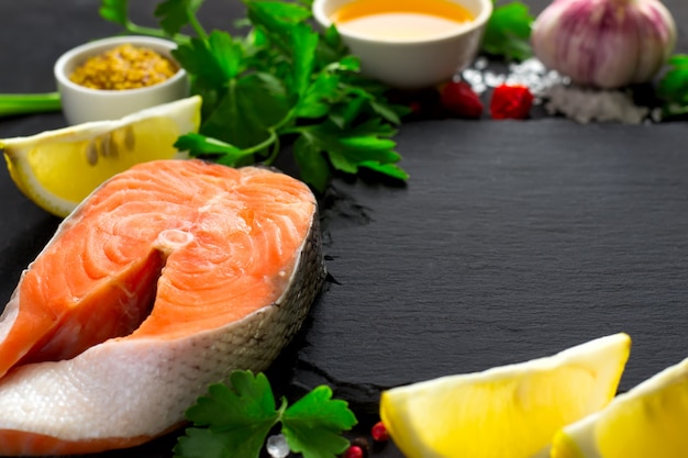 Fresh raw salmon steak and ingredients