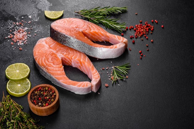 Fresh raw salmon steak with spices and herbs prepared for grilled baking. Healthy seafood food