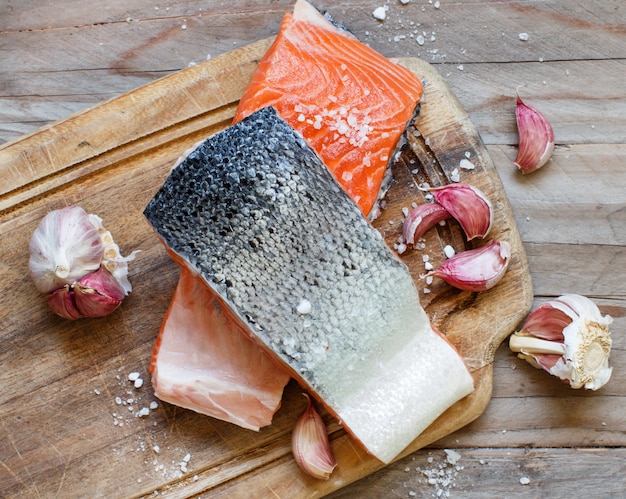 Fresh raw salmon on a wooden cutting board