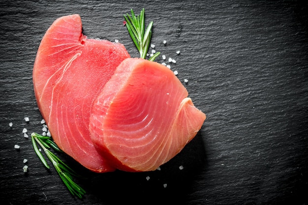 Fresh raw tuna steak with rosemary