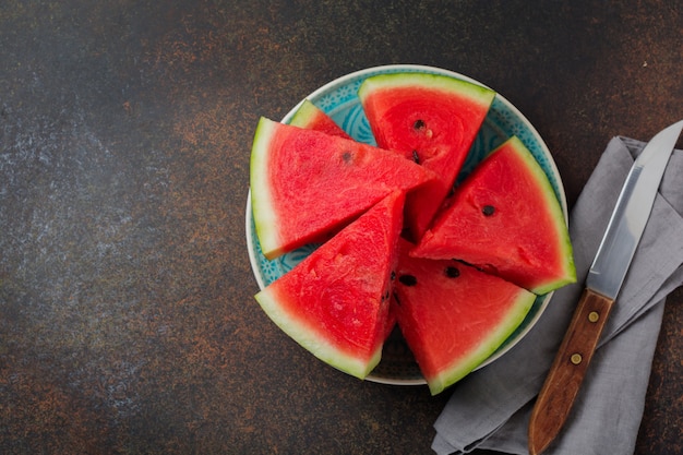 Fresh raw watermelon on a grey table