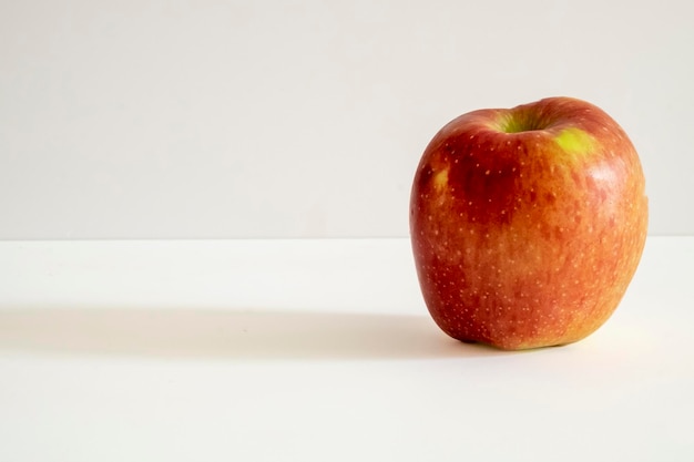 A fresh red apple on a white background