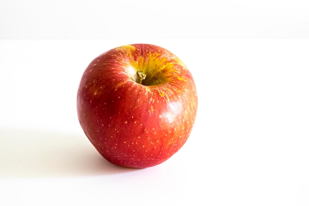 A fresh red apple on a white background