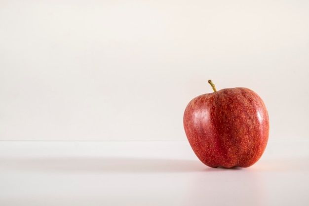 A fresh red apple on a white background