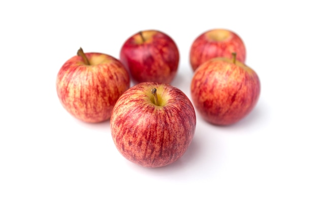 Fresh red apples isolated on white surface