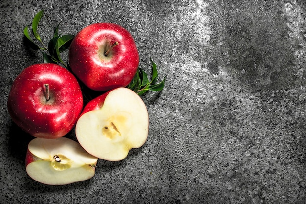 Fresh red apples. On a rustic background.