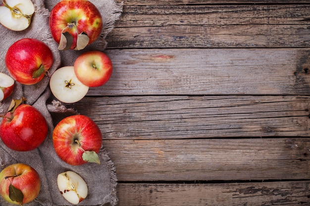 Fresh red apples on wooden background.Copy space.selective focus.