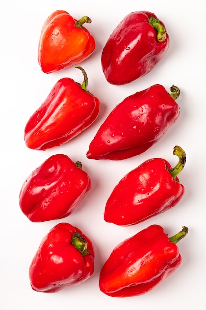 Fresh red bell peppers on white background