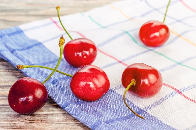 Fresh red cherries in close-up on a napkin