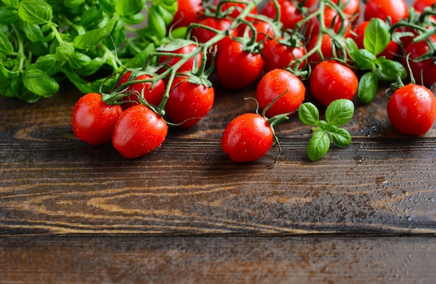 Fresh red cherry tomatoes with basil