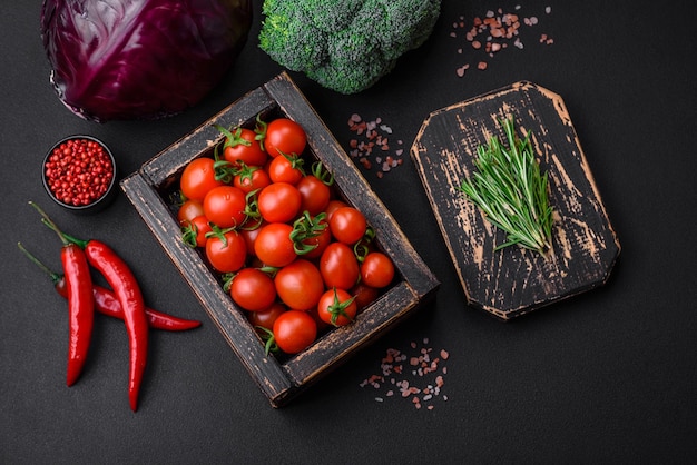 Fresh red cherry tomatoes in a wooden vintage box