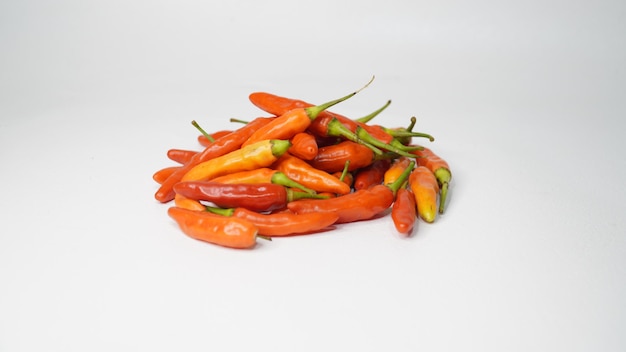 Fresh red chilies on a white background