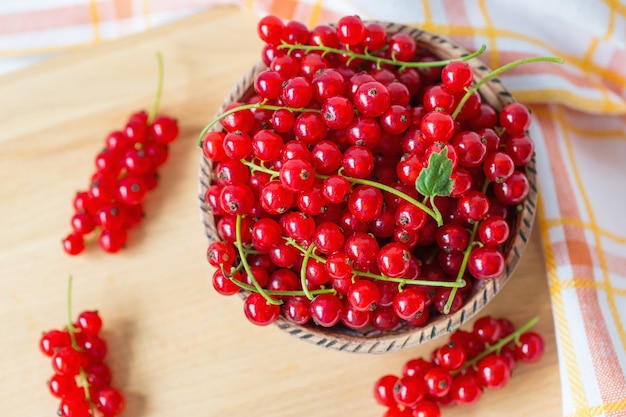 Fresh red currant berries in a bowl 