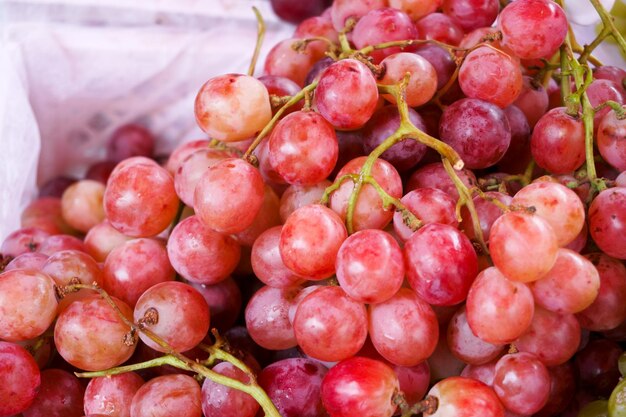 Fresh red grapes fruits at maket