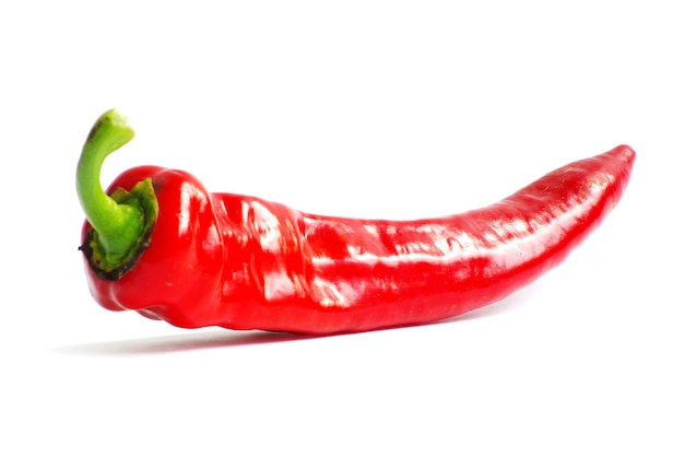 Fresh red hot pepper on a white