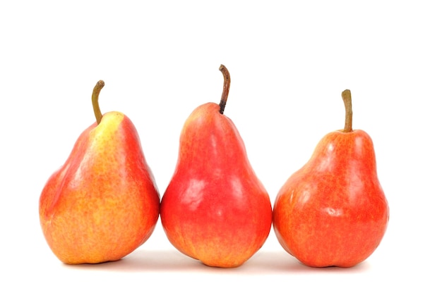 Fresh red pears on a white background close up