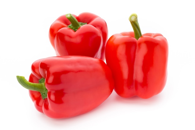 Fresh red pepper on white surface, isolated.