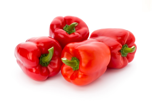 Fresh red pepper on white surface, isolated.