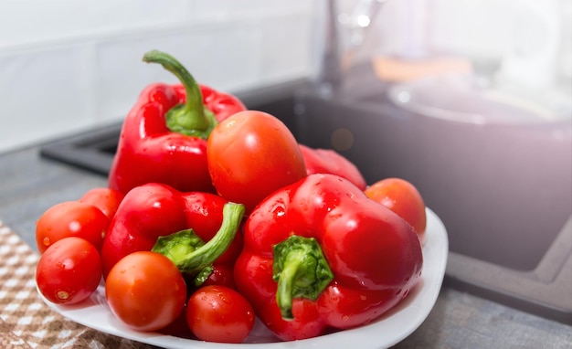 fresh red peppers on a plate in the kitchen