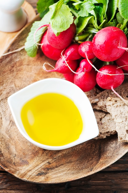 Fresh red radish on the wooden table