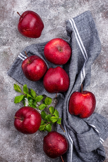 Fresh red ripe apples on gray
