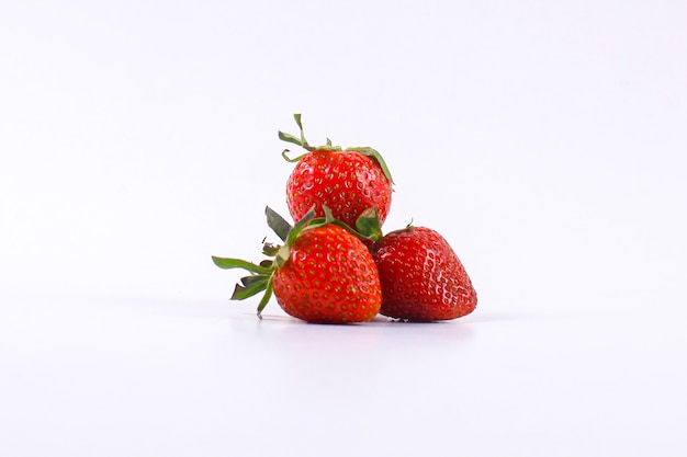 Fresh red strawberries isolated on white background