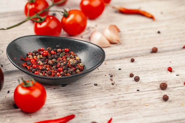 Fresh red tomatoes on light rustic table. Tomato variety