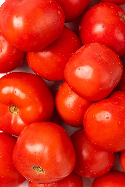 Fresh red tomatoes solid background