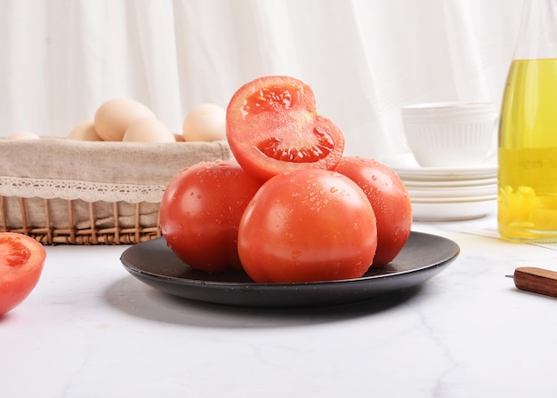 Fresh red tomatoes on white background