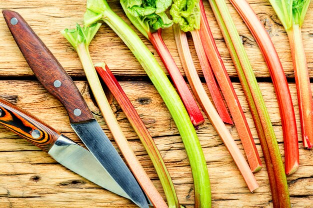 Fresh rhubarb stem on old wooden table.Food concept