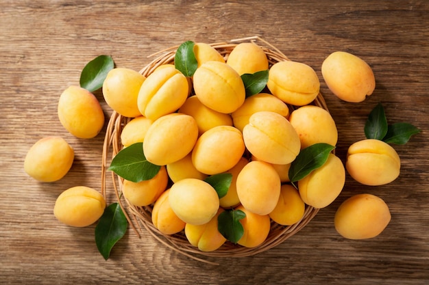 Fresh ripe apricots on a wooden table