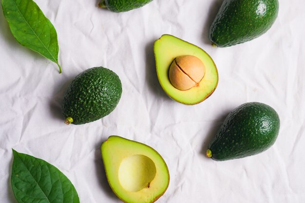 Fresh ripe avocado on white.