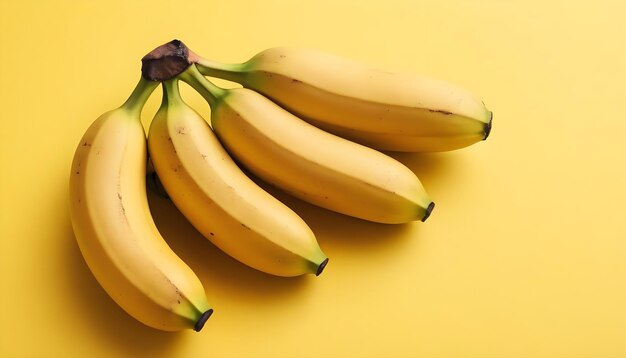 Fresh ripe bananas on a yellow background Photo banner space for text